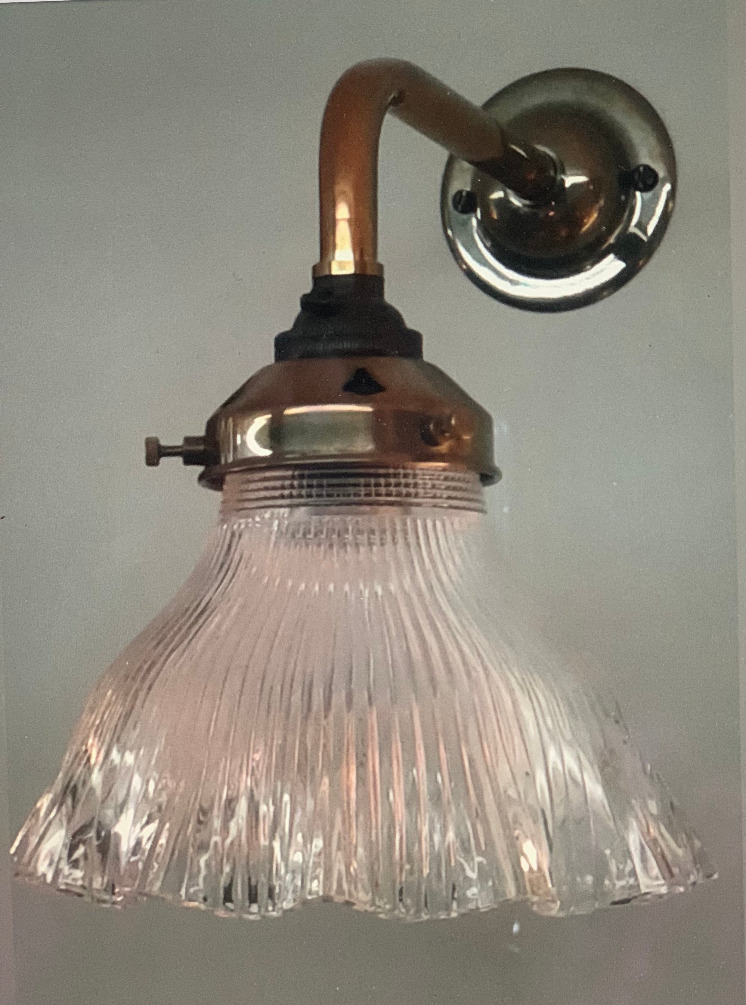 Simple brass and glass bracket.