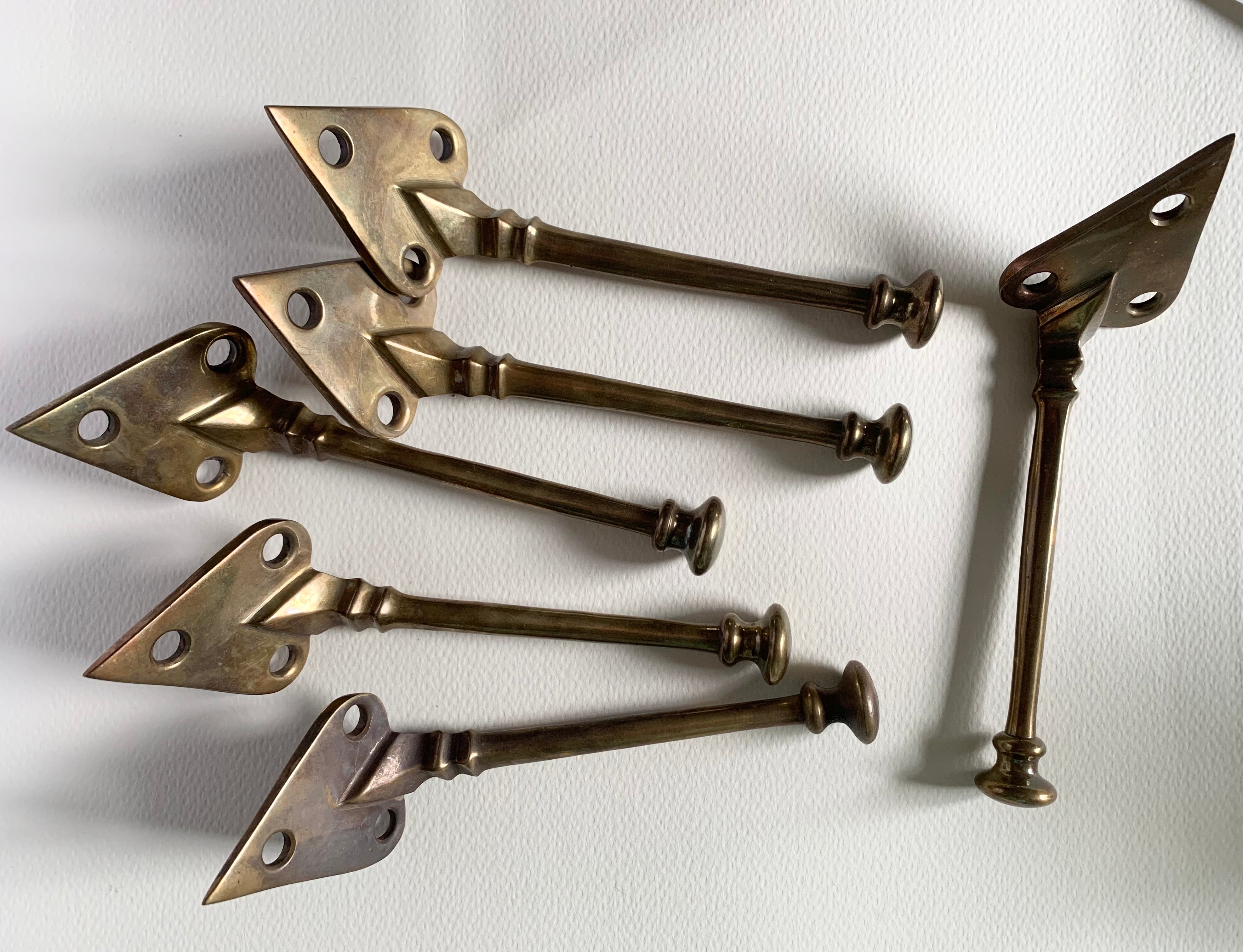 Set of 6 no. Voysey style coat hooks, aged brass