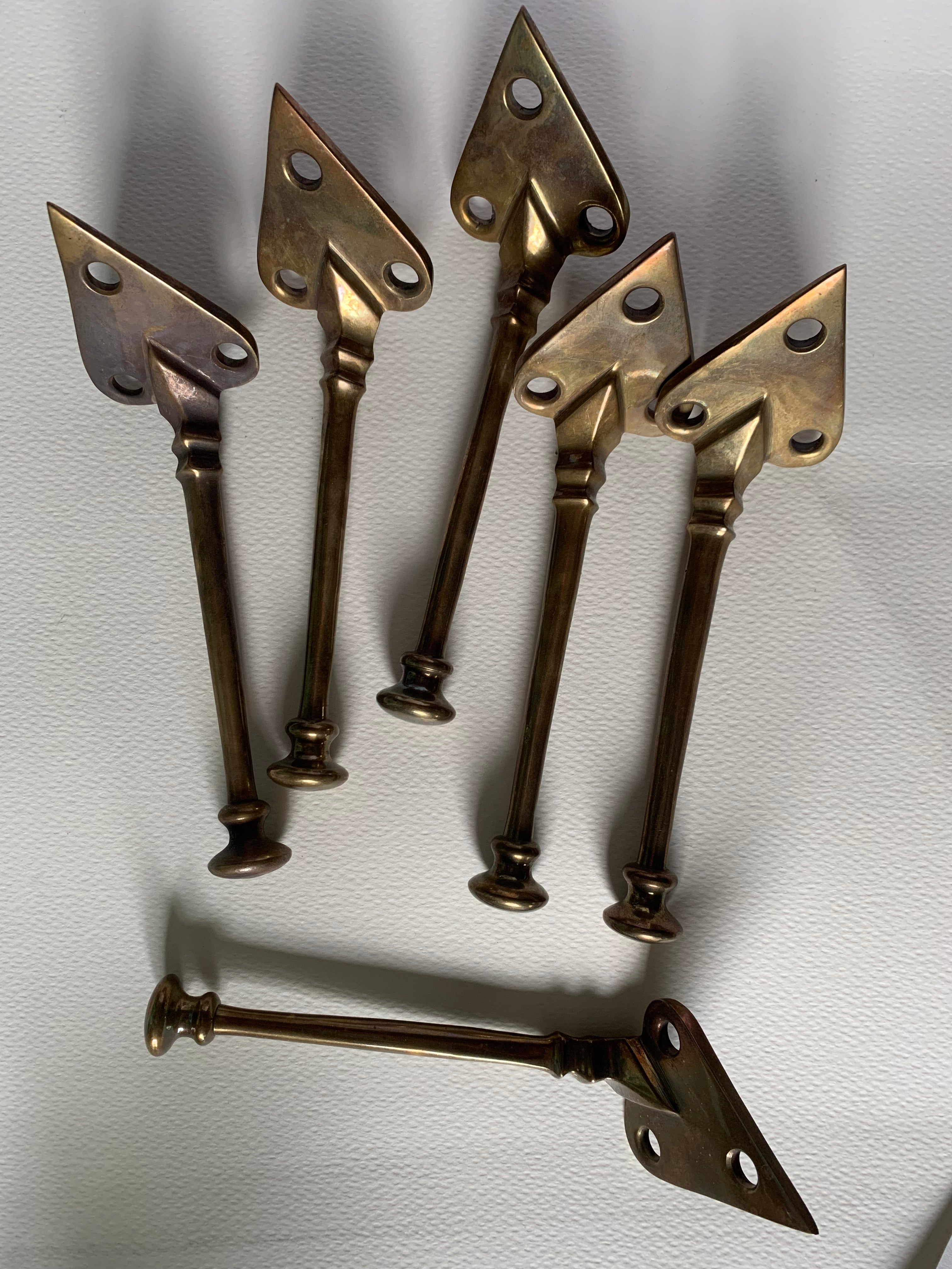 Set of 6 no. Voysey style coat hooks, aged brass