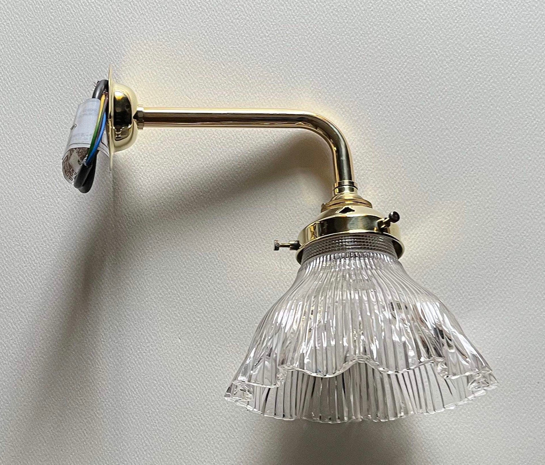 Simple brass and glass bracket.