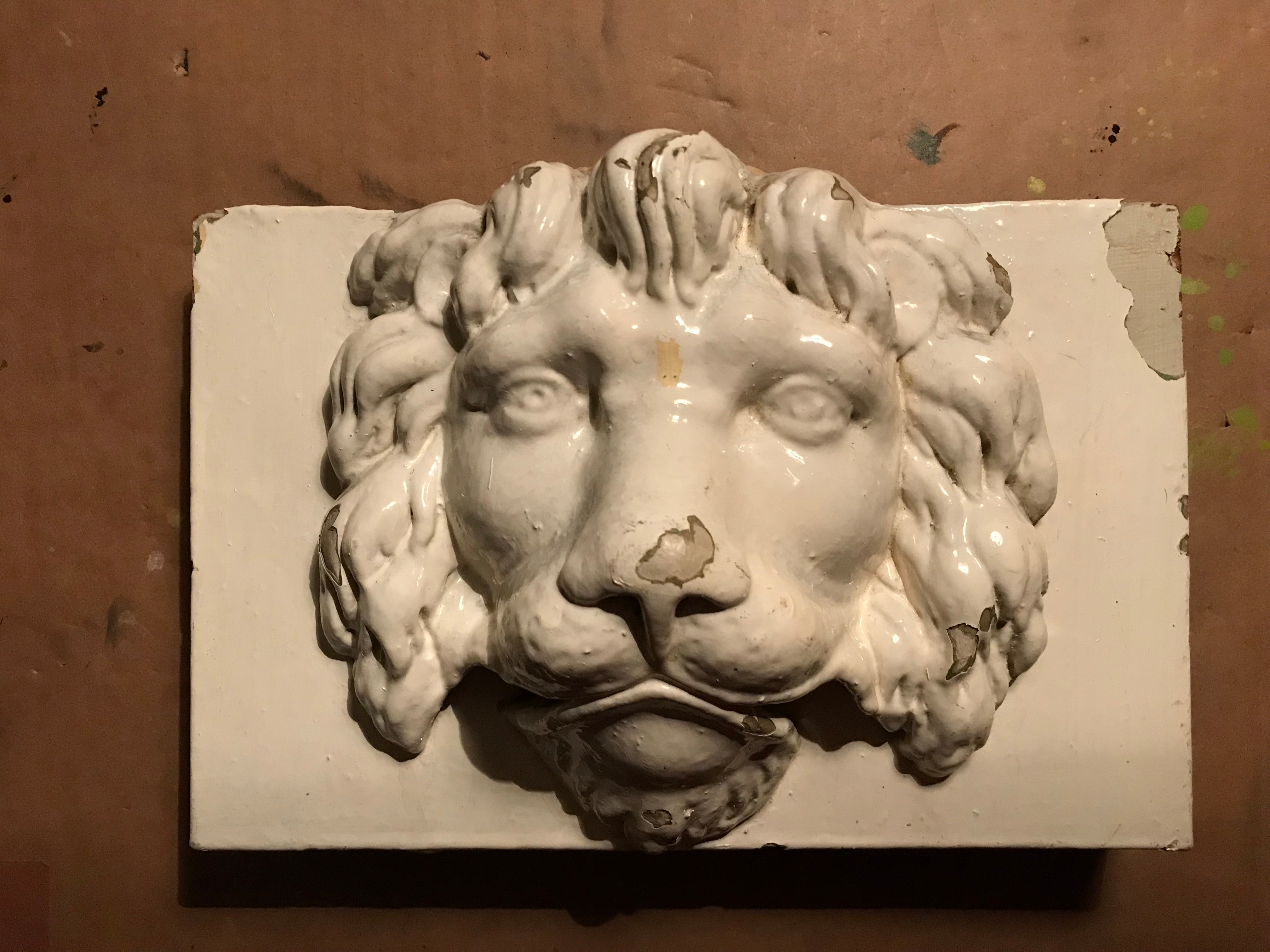 Antique Lion Face with cream paint.