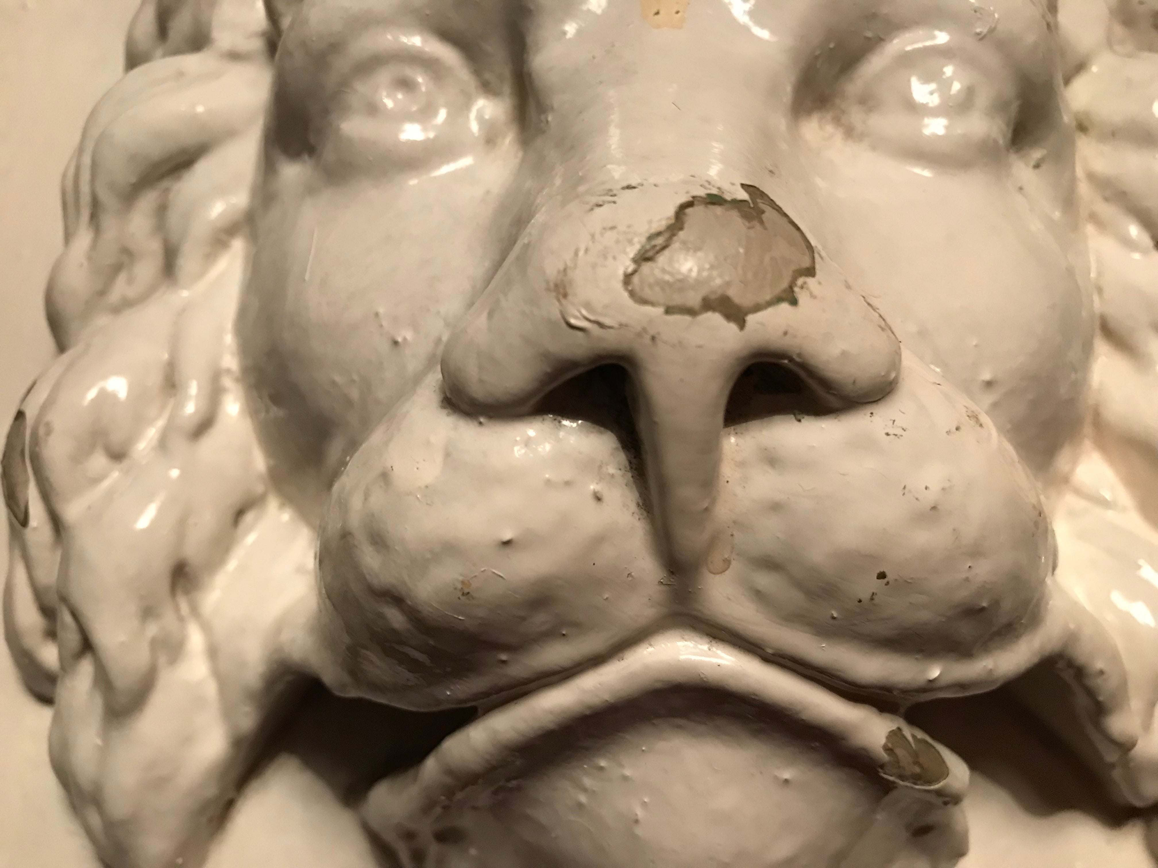 Antique Lion Face with cream paint.