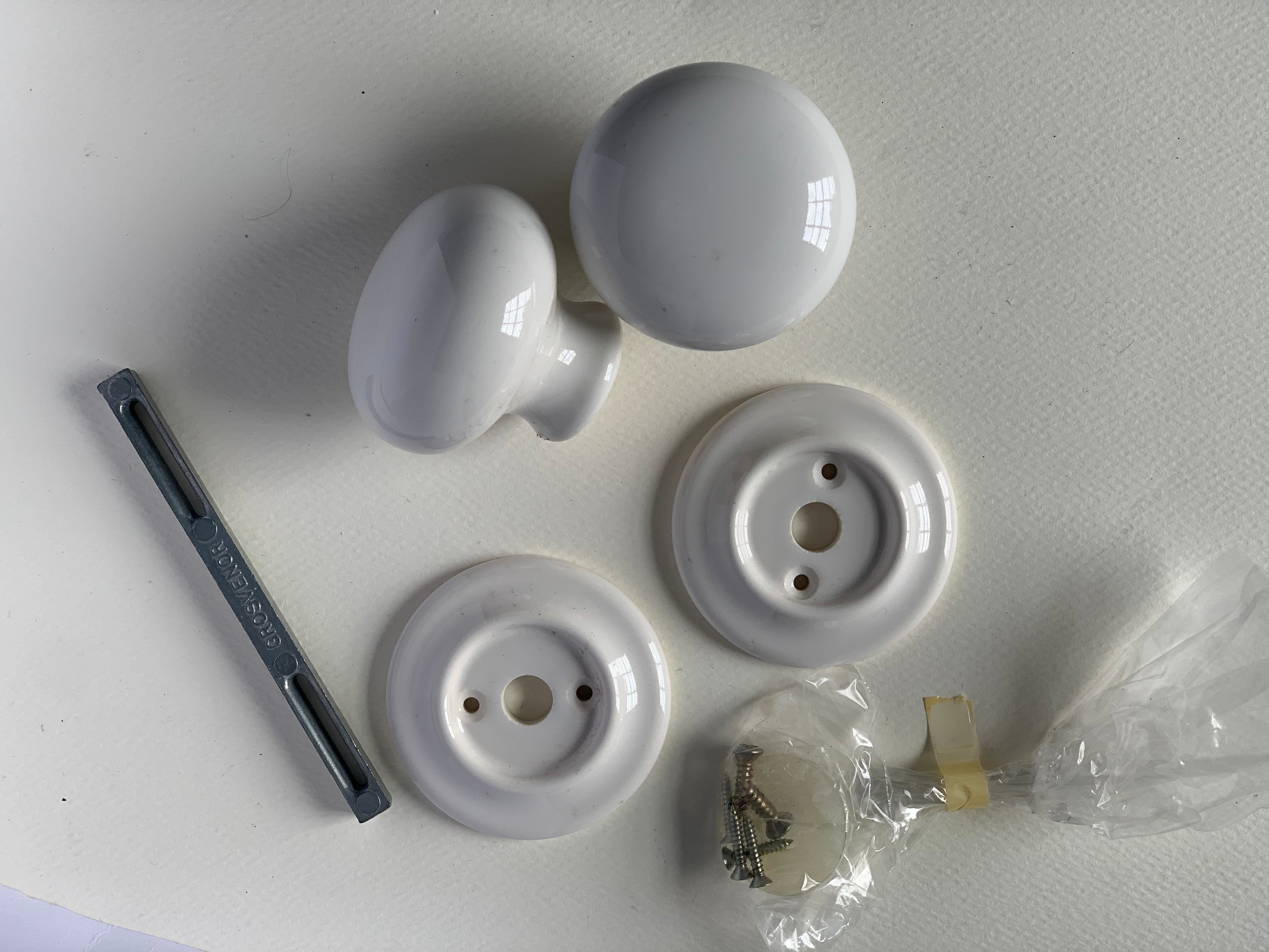 white ceramic door knob set