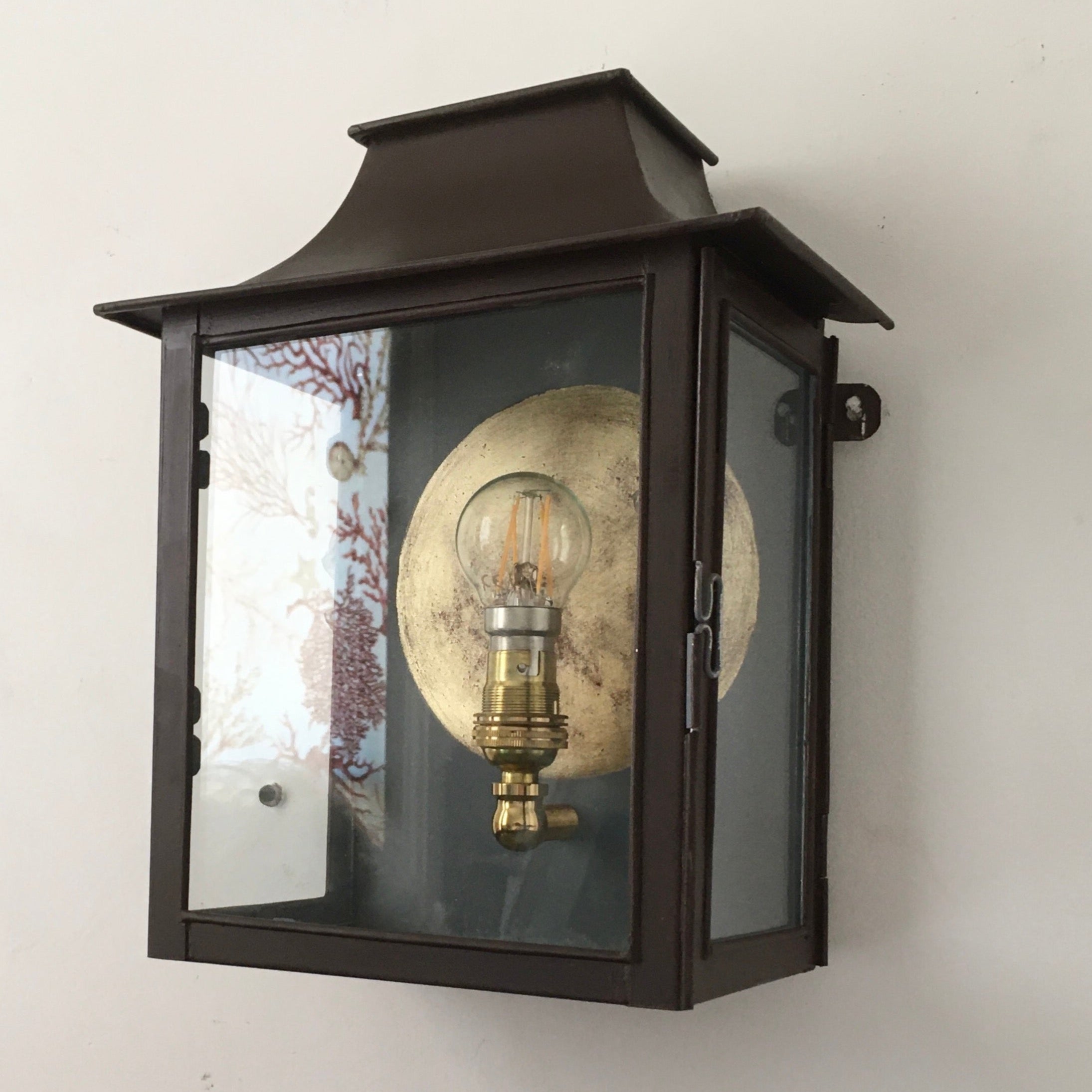 Painted tin lantern with Gilt circle.