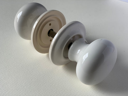 white ceramic door knob set